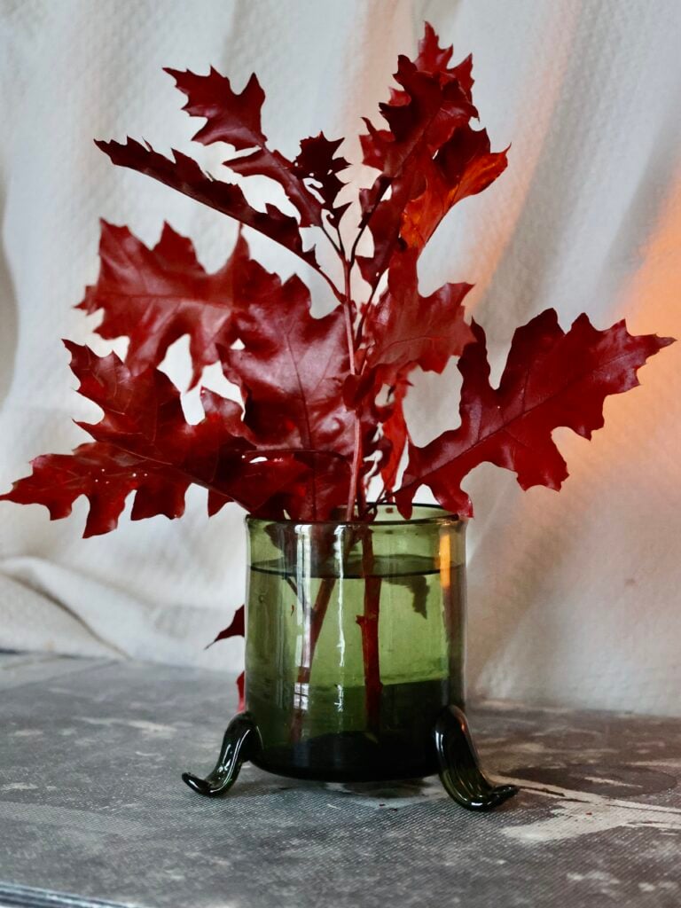 hurricane-vase-with-3-feet-vert-fumé-mouth-blown-recycled-glass