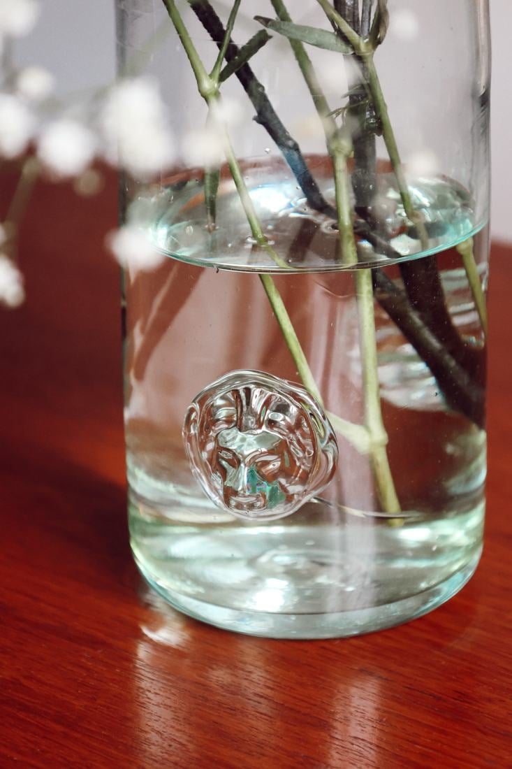 Lion medallion pressed into the glass